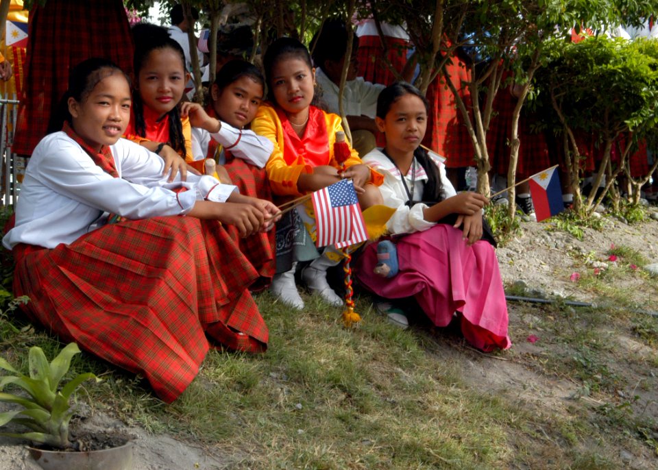 US Navy 070217-N-9604C-008 A group of students wait for the 7th Fleet Band to perform at Bawing High School during a community service project