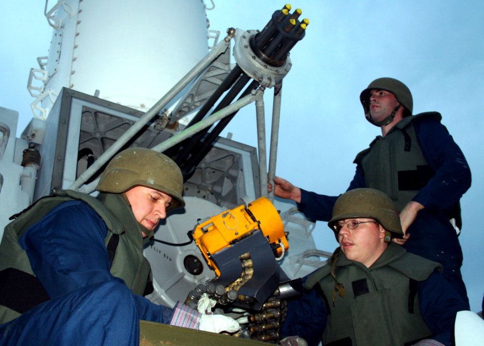 US Navy 070219-N-6710M-004 Fire Control Technician 2nd Class Justin A. Proffitt, Fire Control Technician 3rd Class Michael P. Coyle and Fire Control Technician 3rd Class Chris M. Searles upload live rounds into a Close In Weapo