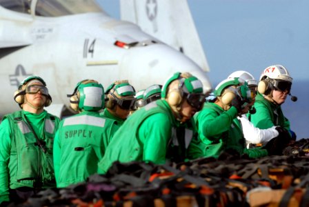 US Navy 070214-N-2959L-034 Sailors assigned to the Nimitz-Class aircraft carrier USS Ronald Reagan (CVN 76) Supply Department await the commencement of a vertical replenishment (VETREP) with Military Sealift Command (MSC) comba photo