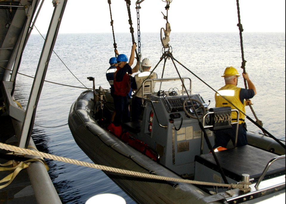 US Navy 070220-N-8446A-002 Members of the surface search and rescue team are lowered into the water in a rigid hull inflatable boat (RHIB) during a man overboard drill aboard Nimitz-class aircraft carrier USS Dwight D. Eisenhow