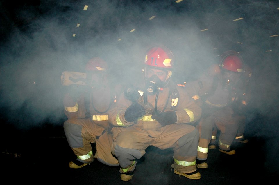 US Navy 070228-N-9760Z-044 Sailors participate in a fire drill to improve their firefighting capabilities aboard nuclear-powered aircraft carrier USS Nimitz (CVN 68)