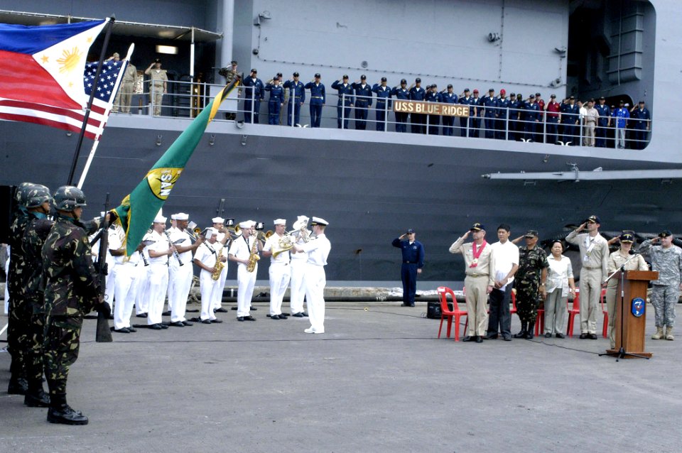 US Navy 070216-N-9604C-017 The Philippine Army Color Guard renders honors as U.S. Sailors salute during the 7th Fleet Navy Band's performance of the national anthem at the welcoming ceremony of amphibious command ship USS