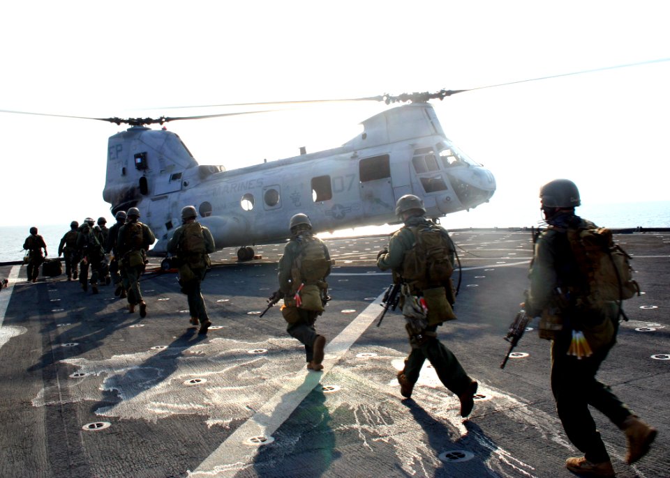 US Navy 070221-N-6710M-005 Members from the 31st Marine Expeditionary Unit prepare to board CH-46 helicopter while conducting a profile exercise with members from USS Tortruga (LSD 46) Visit, Board, Search and Seizure (VBSS) te