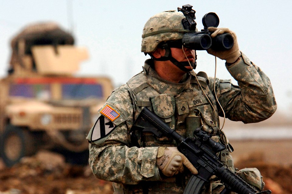 US Navy 070222-N-8148A-287 Pfc. Jason Dore, a forward observer assigned to 2nd Battalion, 5th Cavalry Regiment, 1st Cavalry Division, searches for contacts to safeguard a team