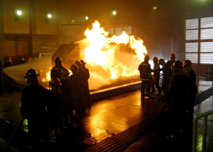 US Navy 070301-N-4649C-128 Sailors from the conventionally powered aircraft carrier USS Kitty Hawk (CV 63) fight a simulated aircraft fire at the Center for Naval Engineering Learning Site, Yokosuka