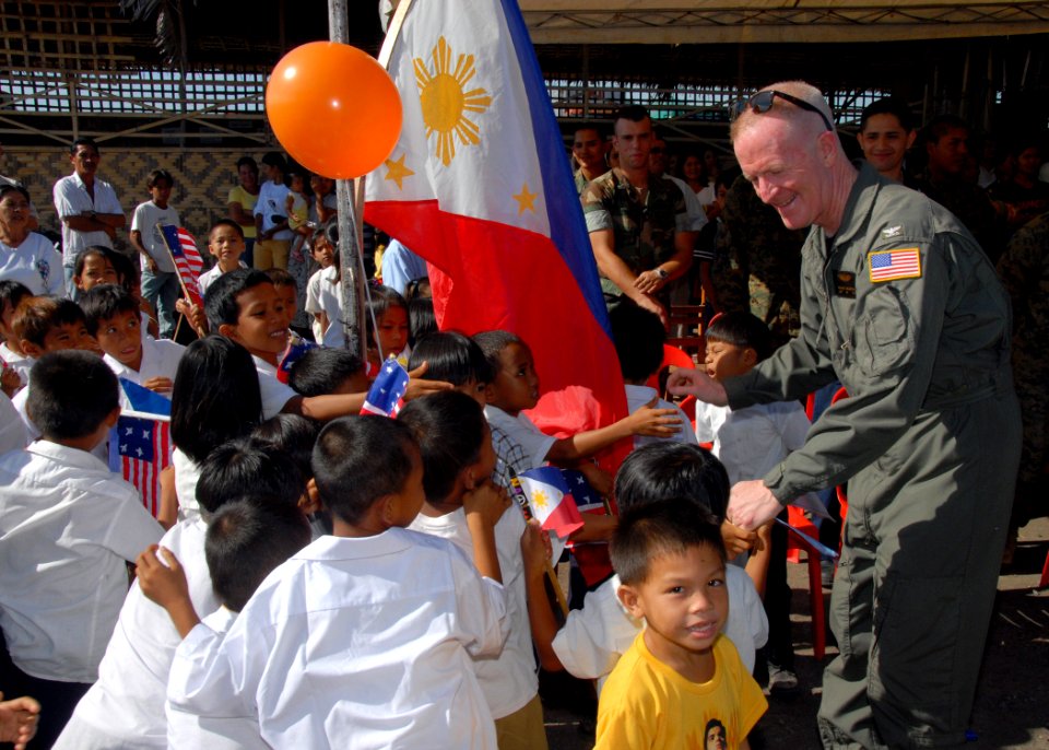 US Navy 070218-N-9860Y-293 Following a two-day construction project at Changco Elementary School, Capt. Michael McCarten, 7th Fleet surgeon, greets students of the school during a dedication ceremony