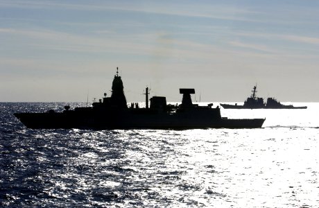 US Navy 070224-N-5459S-038 German frigate FGS Sachsen (F219) sails in front of guided missile destroyer USS Carney (DDG-64) during a diversion tactics training exercise
