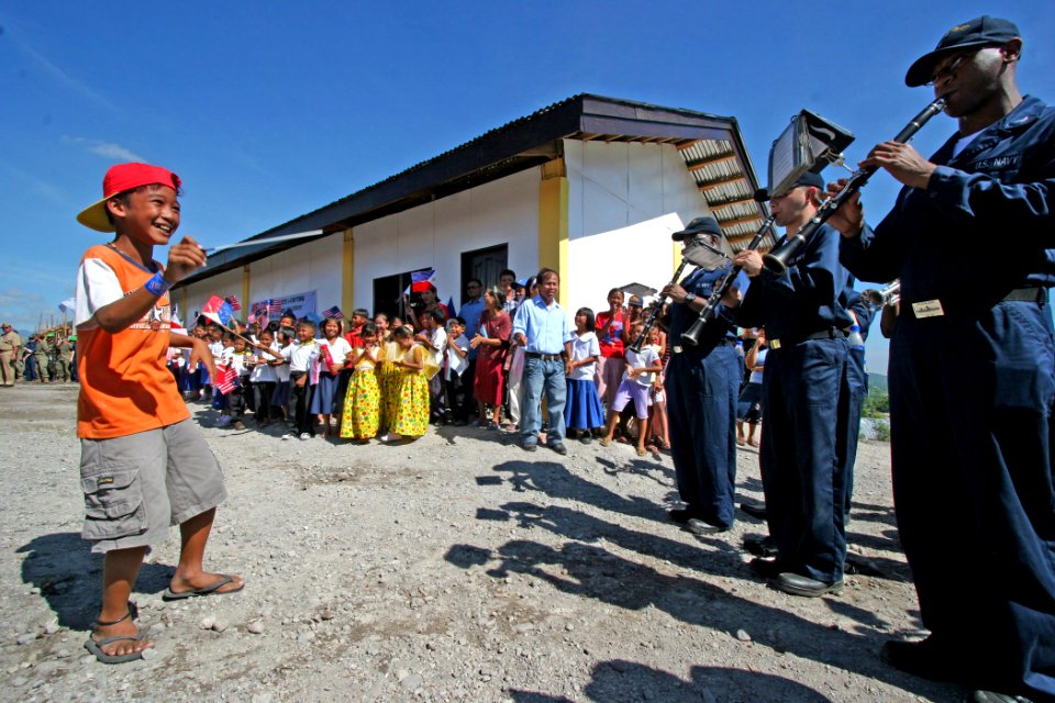 US Navy 070218-N-1113S-002 A young Filipino conducts the 7th Fleet band at Changco Elementary School