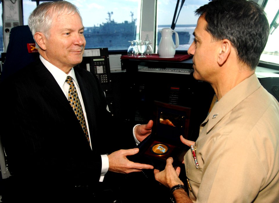 US Navy 070222-N-8923M-073 Secretary of Defense (SECDEF), the Honorable Dr. Robert M. Gates, presents his ceremonial coin to Commanding Officer Capt. Herman Shelanski on the bridge aboard USS Harry S. Truman (CVN 75)