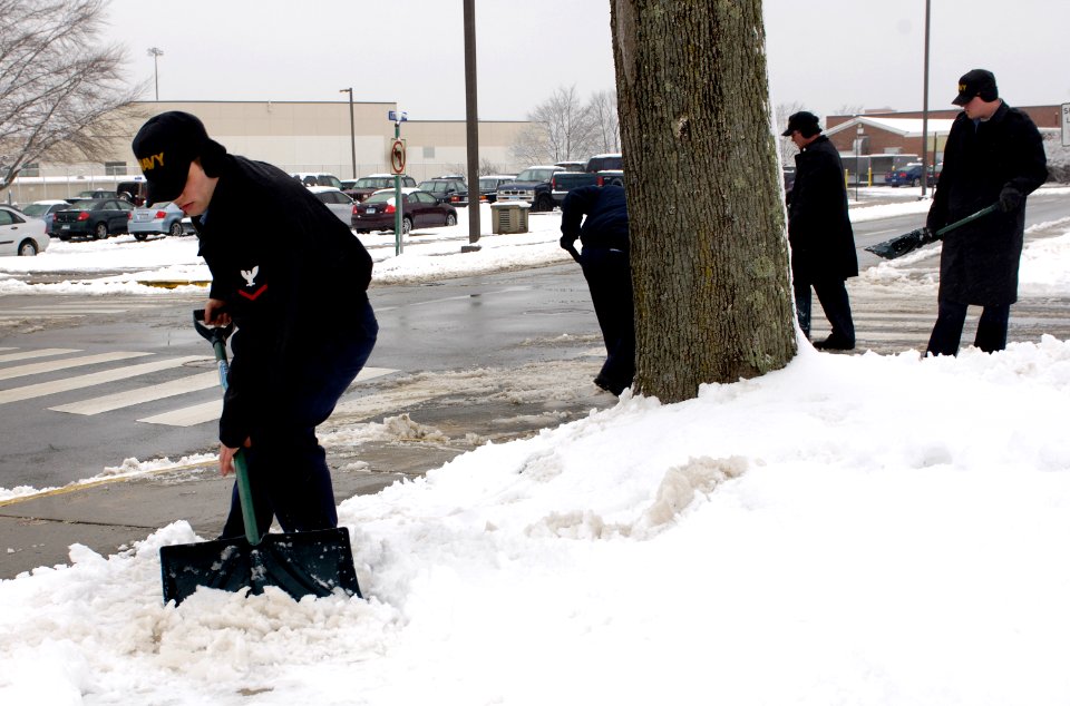 US Navy 070226-N-8467N-002 Machinist's Mate 3rd Class Michael Kilpatrick shovels snow from the sidewalks at Submarine Base New London