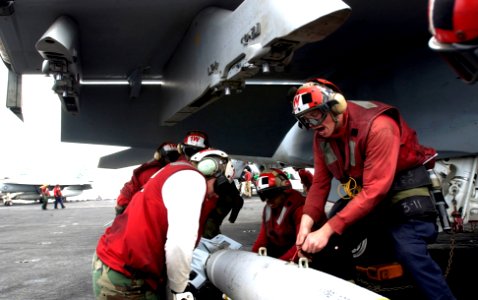 US Navy 070302-N-7130B-037 Sailors assigned to the Nimitz-class aircraft carrier USS Ronald Reagan (CVN 76) direct the loading of a Guided Bomb Unit-38 (GBU-38) onto an F-A-18F Super Hornet