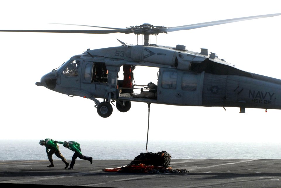 US Navy 070228-N-2659P-064 An MH-60S Seahawk assigned to the Dragon Whales of Helicopter Sea Combat Squadron (HSC) 28 departs the fantail during the transfer