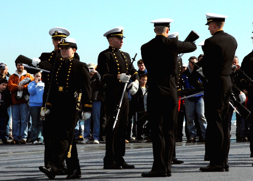 US Navy 070304-N-4565G-002 The United States Naval Academy Silent Drill Team performs on the flight deck of USS John F. Kennedy (CV 67) during general public tours in Boston