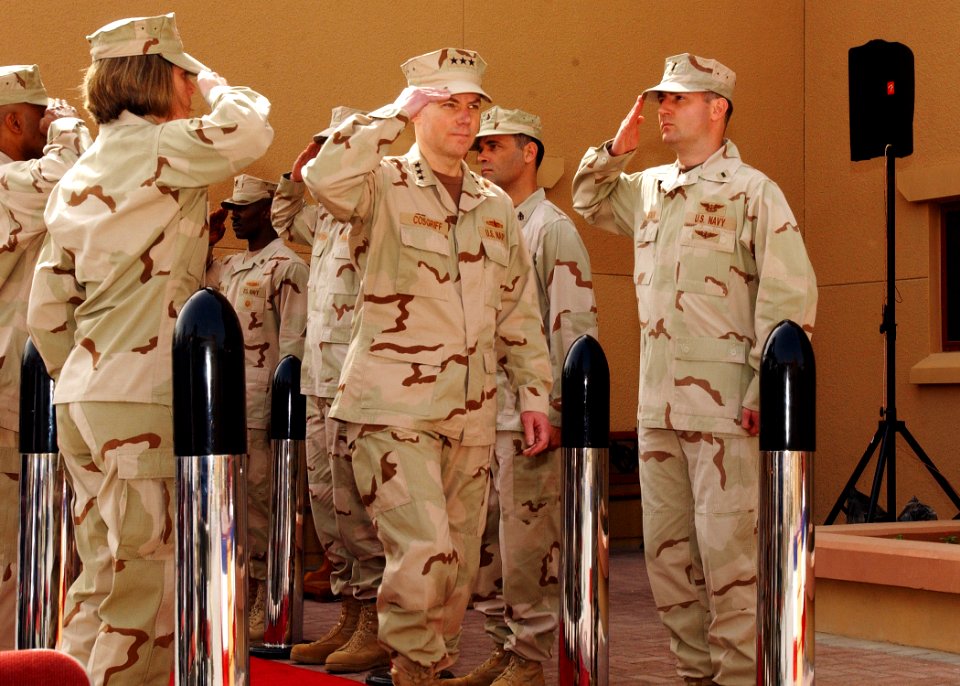 US Navy 070227-N-4205W-004 Vice Adm. Kevin Cosgriff salutes while passing through sideboys during a change of command ceremony at Naval Support Activity, Bahrain