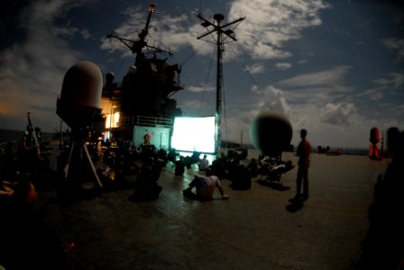 US Navy 070227-N-7312S-157 Sailors assigned to amphibious command ship USS Blue Ridge (LCC 19) and embarked 7th Fleet staff enjoy watching Gridiron Gang on the ship's main deck