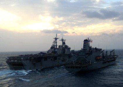 US Navy 070223-N-6710M-001 Amphibious assault ship USS Essex (LHD 2) comes alongside Military Sealift Command (MSC) fleet replenishment oiler USNS Pecos (T-AO 197) for refueling during an underway replenishment (UNREP) in the v