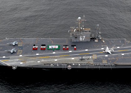 US Navy 070227-N-4565G-005 Sailors aboard USS John F. Kennedy (CV 67) conduct a tribute honoring the ship's 38 years of distinguished commissioned service while steaming toward Boston for a farewell port visit