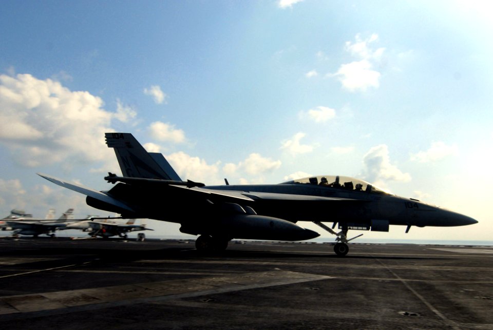US Navy 070224-N-0684R-034 An F-A-18F Super Hornet assigned to the Black Knights of Strike Fighter Squadron (VFA) 154 catches an arresting gear wire during flight operations