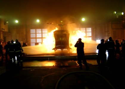 US Navy 070301-N-4649C-137 Sailors from the conventionally powered aircraft carrier USS Kitty Hawk (CV 63) fight a simulated aircraft fire at the Center for Naval Engineering Learning Site, Yokosuka