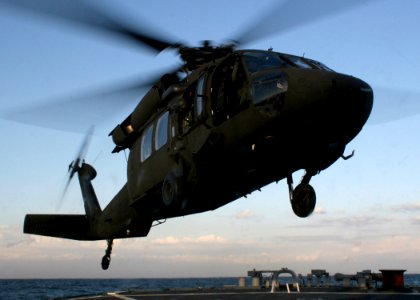 US Navy 070306-N-4953E-007 A UH-60 Blackhawk, assigned to Army's 78th Aviation Battalion, prepares to land on the flight deck of guided missile destroyer USS Stethem (DDG 63) as they perform their Deck Landing Qualificati photo