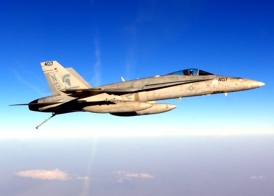US Navy 070302-N-0000H-001 Cmdr. Daniel Cheever, commanding officer of the Argonauts of Strike Fighter Squadron (VFA) 147, flies an F-A-18C Hornet returning to Nimitz-class aircraft carrier USS John C. Stennis (CVN 74)