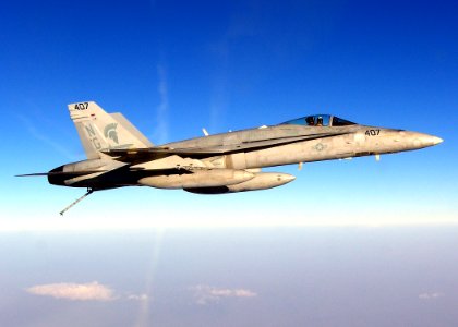 US Navy 070302-N-0000H-001 Cmdr. Daniel Cheever, commanding officer of the Argonauts of Strike Fighter Squadron (VFA) 147, flies an F-A-18C Hornet returning to Nimitz-class aircraft carrier USS John C. Stennis (CVN 74)