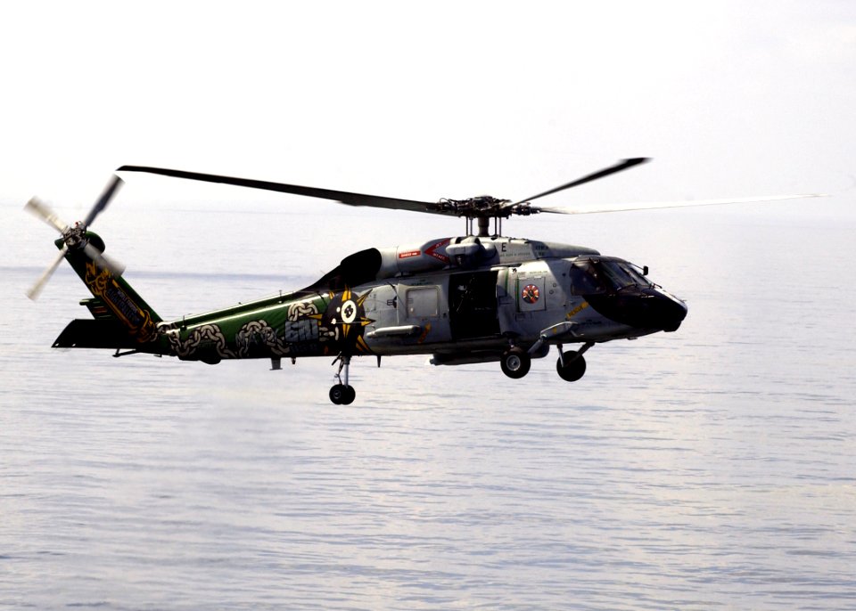 US Navy 070222-N-6854D-003 A helicopter from the Eight-ballers of Helicopter Anti-submarine Squadron (HS) 8 prepares to land on the flight deck of the Nimitz-class aircraft carrier USS Dwight D. Eisenhower (CVN 69)