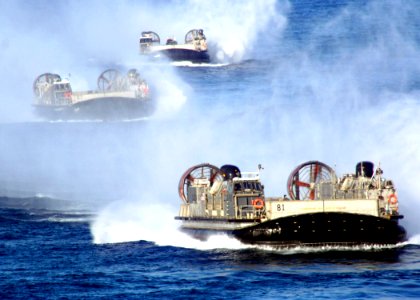 US Navy 070226-N-6710M-001 Three Landing Craft Air Cushions (LCAC) prepare to enter the well deck of the amphibious dock landing ship USS Tortuga (LSD 46) photo