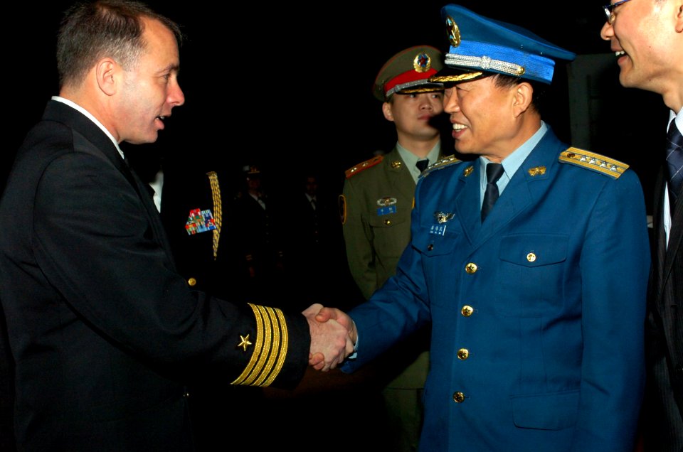 US Navy 070307-N-0555B-232 Air Force Chief of Staff Senior Colonel Jiang Wei Min, People's Liberation Army, shakes the hand of Commanding Officer Capt. Terry B. Kraft, USS Ronald Reagan (CVN 76), on the fantail of the aircraft