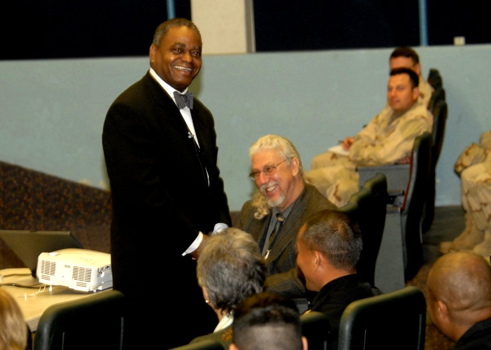 US Navy 070223-N-1226D-010 Distinguished financial journalist Kelvin Boston smiles as he discusses overcoming financial anxieties and the basic steps necessary for military members to reach their financial goals at Naval Base S