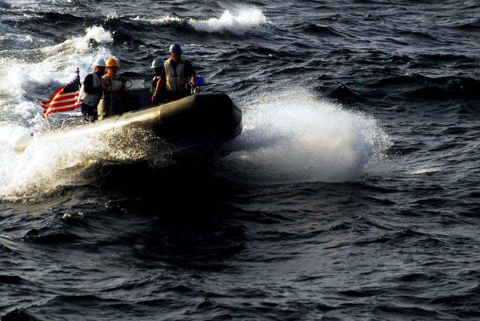 US Navy 070227-N-9928E-044 Sailors assigned to deck department ride on a rigid hull inflatable boat (RHIB) during small-boat operations alongside the Nimitz-class aircraft carrier USS John C. Stennis (CVN 74)