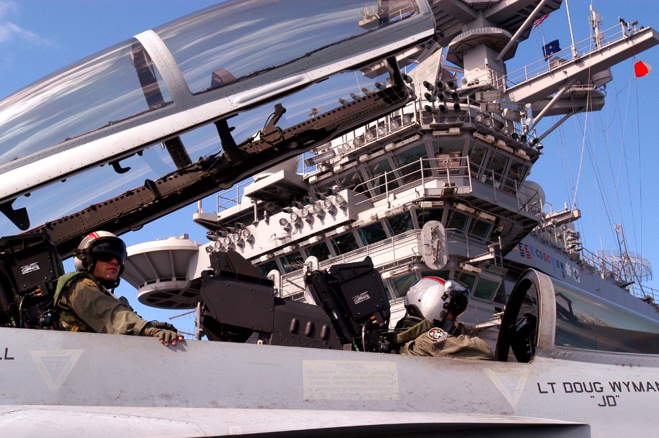 US Navy 070228-N-5484G-038 Lt. Cmdr John Saccomando and Lt. Michael R. Barb, pilots assigned to the Black Aces of Strike Fighter Squadron (VFA) 41, prepare for flight operations in a F-A-18F Super Hornet aboard USS Nimitz (CVN