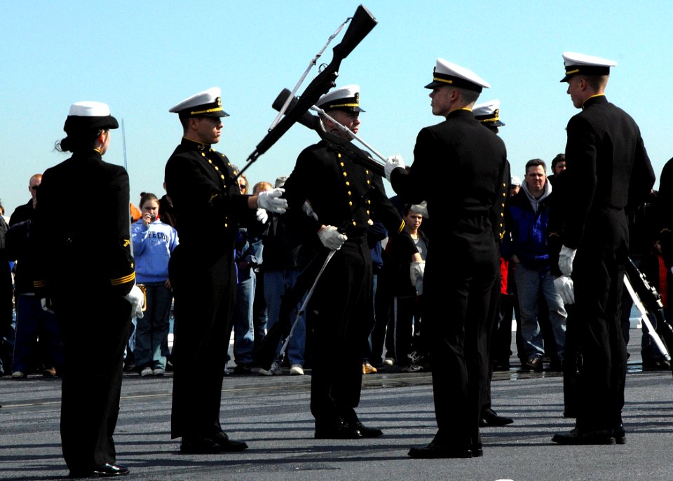 US Navy 070304-N-4565G-003 The United States Naval Academy Silent Drill Team performs on the flight deck of USS John F. Kennedy (CV 67) during general public tours in Boston