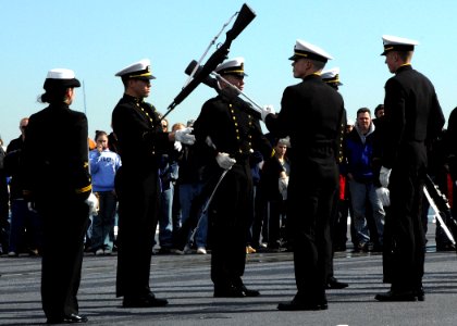 US Navy 070304-N-4565G-003 The United States Naval Academy Silent Drill Team performs on the flight deck of USS John F. Kennedy (CV 67) during general public tours in Boston