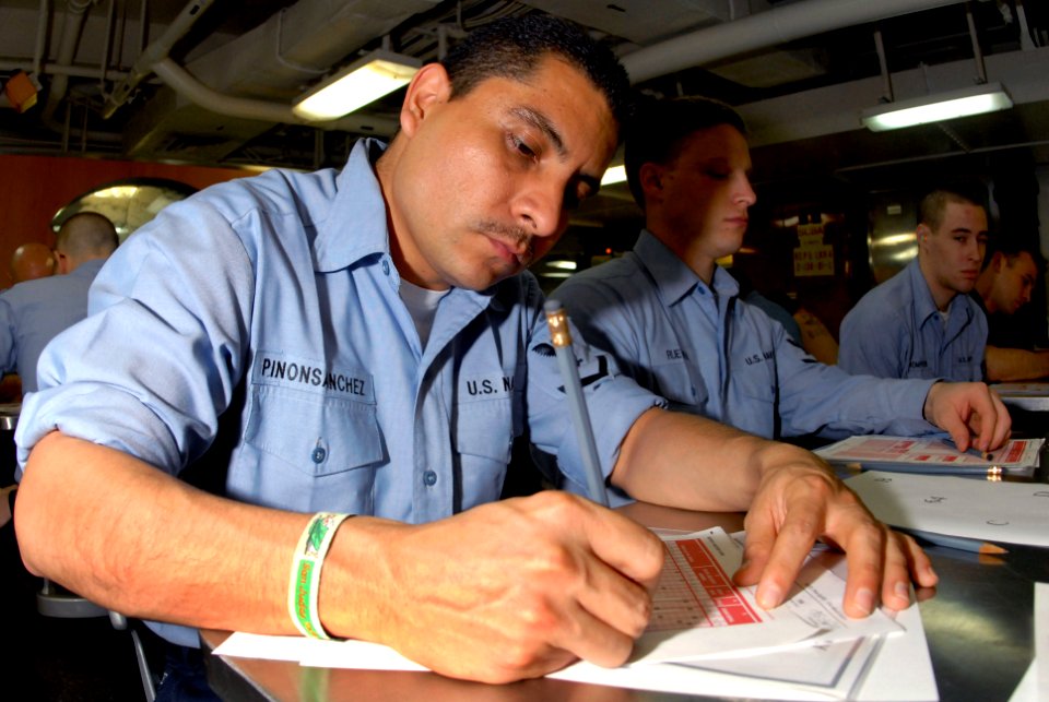 US Navy 070308-N-3038W-006 Machinist's Mate 3rd Class Jose Pinon-Sanchez fills out an answer sheet for the second class petty officer advancement exam aboard Nimitz-class aircraft carrier USS John C. Stennis (CVN 74)