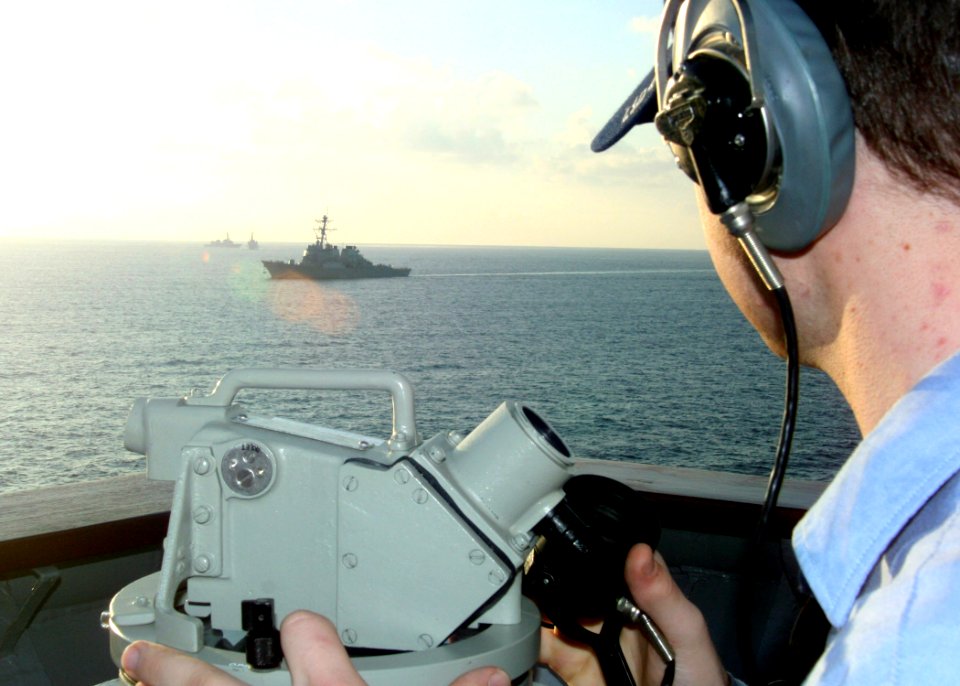 US Navy 070226-N-6710M-011 Quartermaster Seaman David B. Heismann takes bearings as dock landing ship USS Tortuga (LSD 46) passes through the busy waterways of Okinawa, Japan