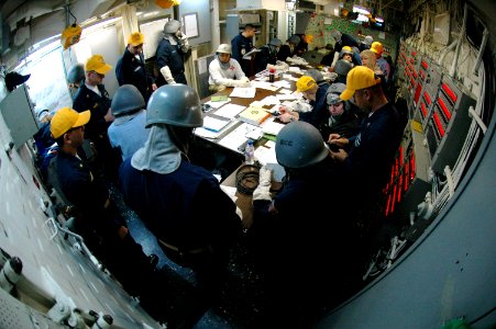 US Navy 070227-N-0209M-005 The Damage Control Training Team aboard amphibious assault ship USS Boxer (LHD 4) trains Sailors during a communications drill in damage control central