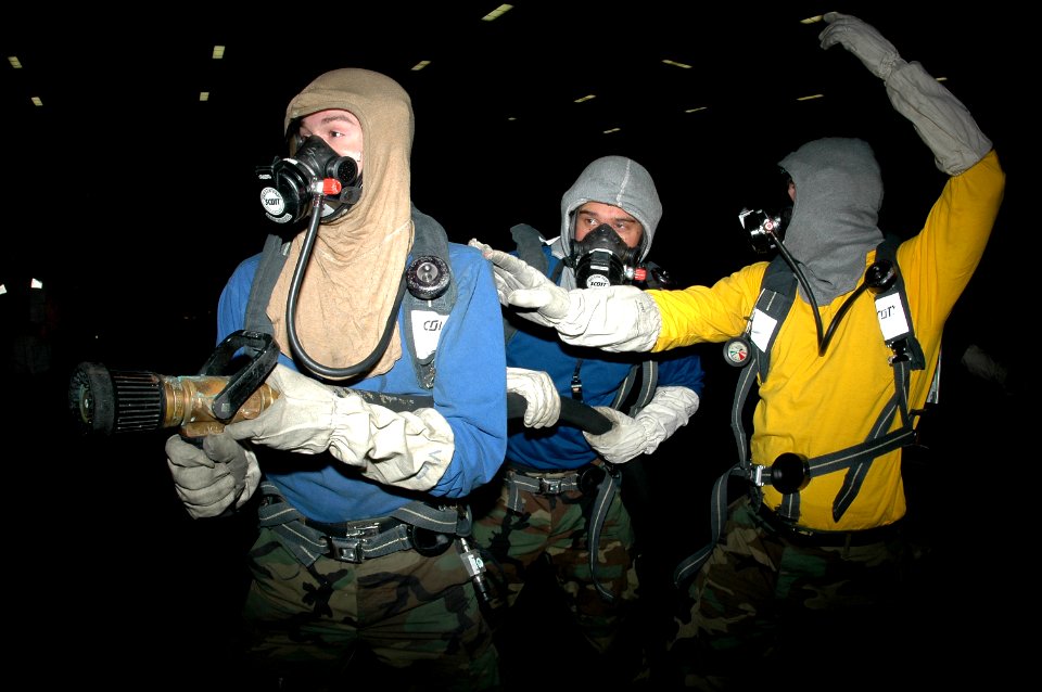 US Navy 070228-N-9760Z-024 Sailors assigned to air department participate in a fire drill to improve their firefighting capabilities aboard nuclear-powered aircraft carrier USS Nimitz (CVN 68)