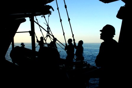 US Navy 070306-N-0684R-068 Sailors assigned to deck department tend the lines of a rigid hull inflatable boat (RHIB) as they are lowered into the water next to Nimitz-class aircraft carrier USS John C. Stennis (CVN 74)