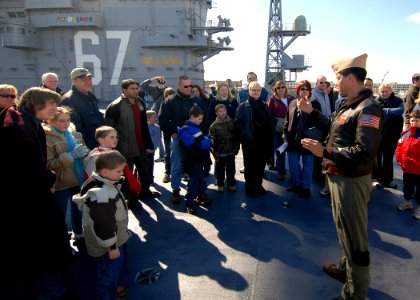 US Navy 070304-N-4565G-011 Cmdr. Mark Gonzales, assigned to Sea Control Squadron (VS) 24, answers questions about the S-3B Viking during general public tours aboard USS John F Kennedy (CV 67)