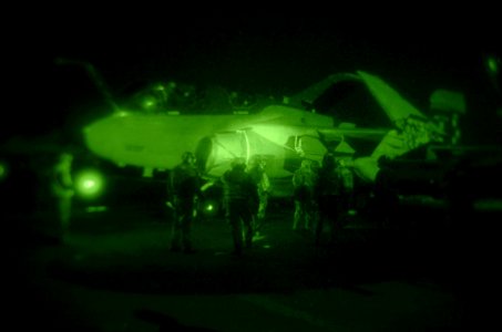US Navy 070301-N-5484G-145 Sailors secure an EA-6B Prowler to the flight deck of nuclear-powered aircraft carrier USS Nimitz (CVN 68) after completing night time flight operations photo