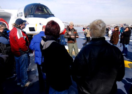 US Navy 070304-N-4565G-009 Cmdr. Mark Gonzales, assigned to Sea Control Squadron (VS) 24, answers questions about the S-3B Viking during general public tours aboard USS John F Kennedy (CV 67)