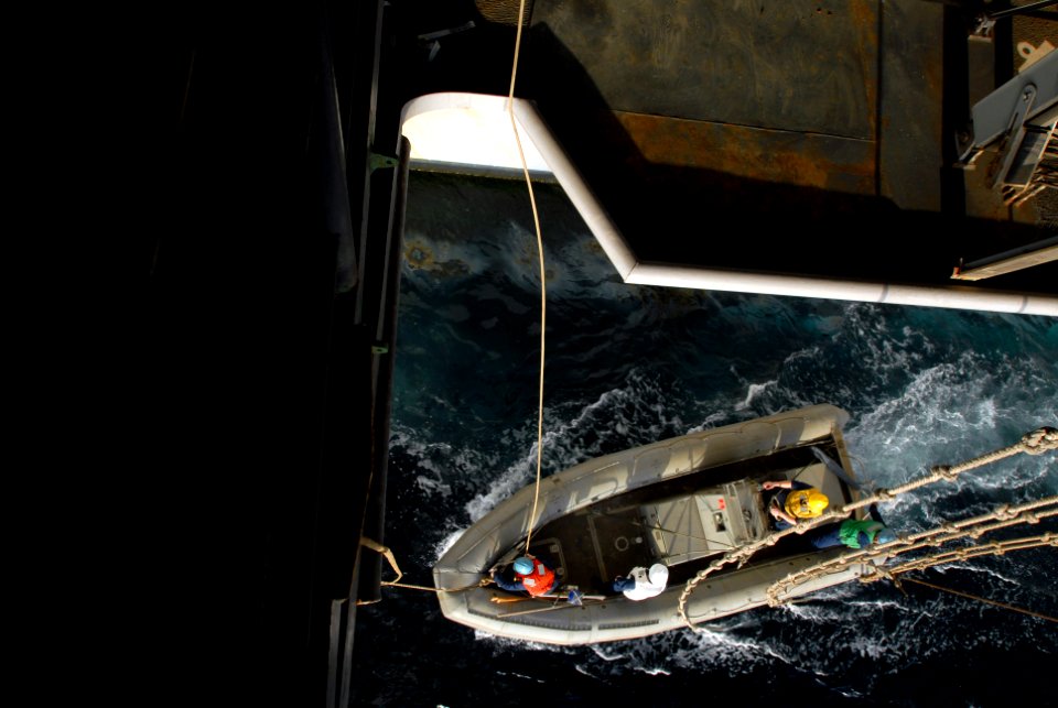 US Navy 070306-N-2659P-095 Boatswain's mates assigned to deck department are lowered into the water in a rigid hull inflatable boat (RHIB) next to Nimitz-class aircraft carrier USS John C. Stennis (CVN 74)