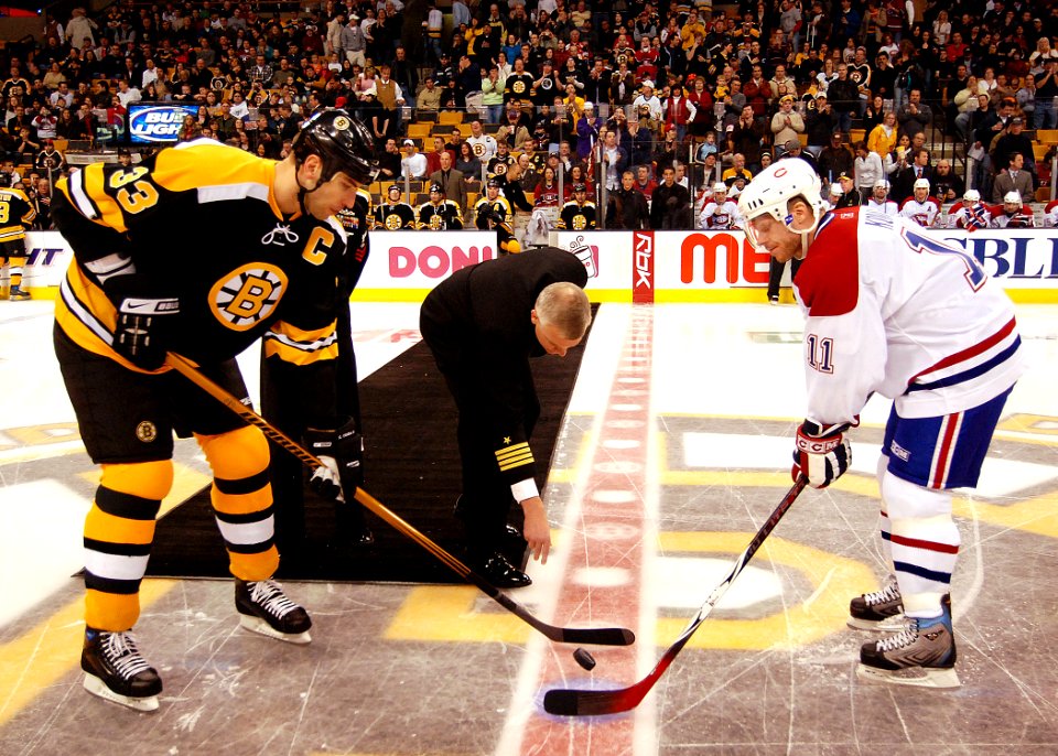 US Navy 070303-N-4565G-006 Capt. Todd A. Zecchin, commanding officer of USS John F. Kennedy (CV 67), drops the ceremonial puck at the Boston Bruins and Montreal Canadians game at the TD Bank North Garden