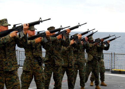 US Navy 070312-N-4124C-005 Marines of the 1st Marine Aircraft Wing Unit (MAU), based out of Okinawa, Japan, conduct a practice fire of a 21-gun salute on the flight deck of dock landing ship USS Harpers Ferry (LSD 49)