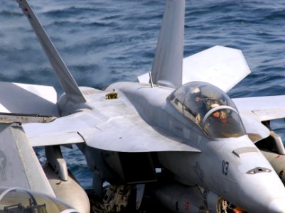 US Navy 070313-N-3038W-238 Pilots assigned to the Black Knights of Strike Fighter Squadron (VFA) 154 test their F-A-18F Super Hornet's ailerons prior to launch photo