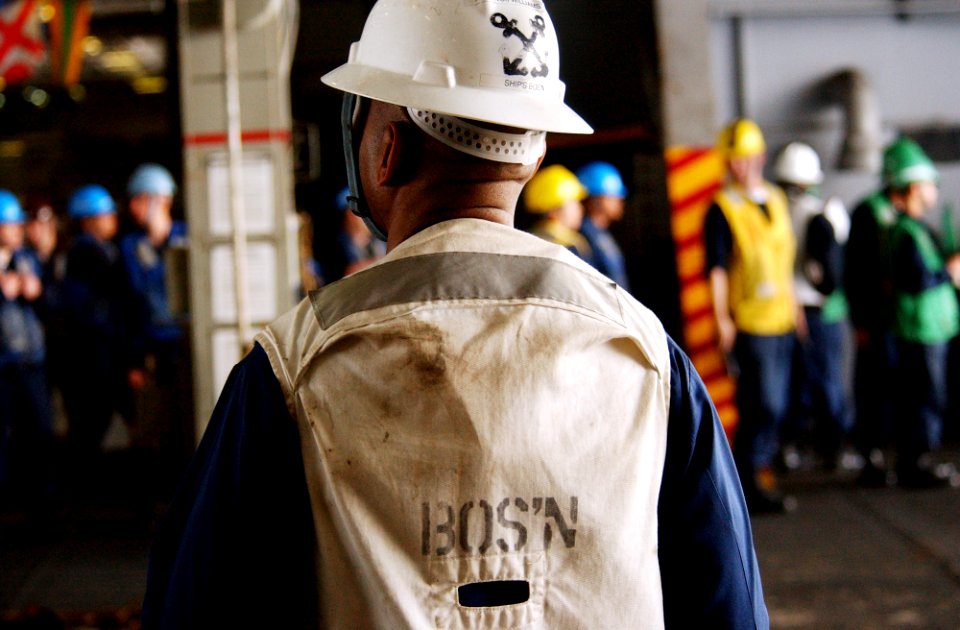 US Navy 070302-N-4009P-397 Chief Warrant Officer Rich Williams from Fort Lauderdale, Fla., oversees operations in hangar bay three during a replenishment at sea aboard USS Ronald Reagan (CVN 76)