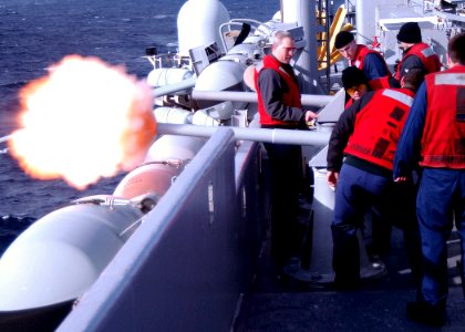 US Navy 070308-N-4565G-002 Gunner's Mate 1st Class Robert A. Clay orders Sailors assigned to weapons department to fire the ceremonial 40mm battery gun aboard USS John F Kennedy (CV 67)