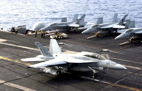 US Navy 070302-N-9712C-002 An F-A-18E Super Hornet assigned to the Fighting Redcocks of Strike Fighter Squadron (VFA) 22, lands on board USS Ronald Reagan (CVN 76)