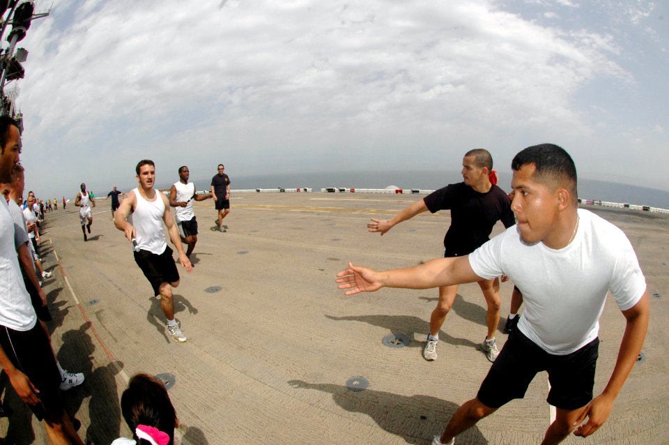 US Navy 070309-N-0209M-002 Sailors assigned aboard amphibious assault ship USS Boxer (LHD 4) participate in a 5K Captain's Cup relay race held on the ship's flight deck